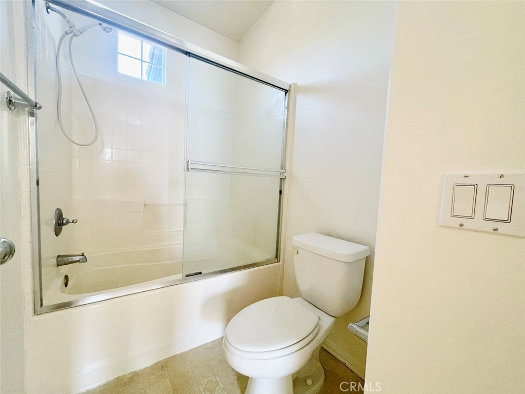 65 Passage Irvine, CA 92603 - Photo 24 of 28 a white toilet sitting next to a bath tub
