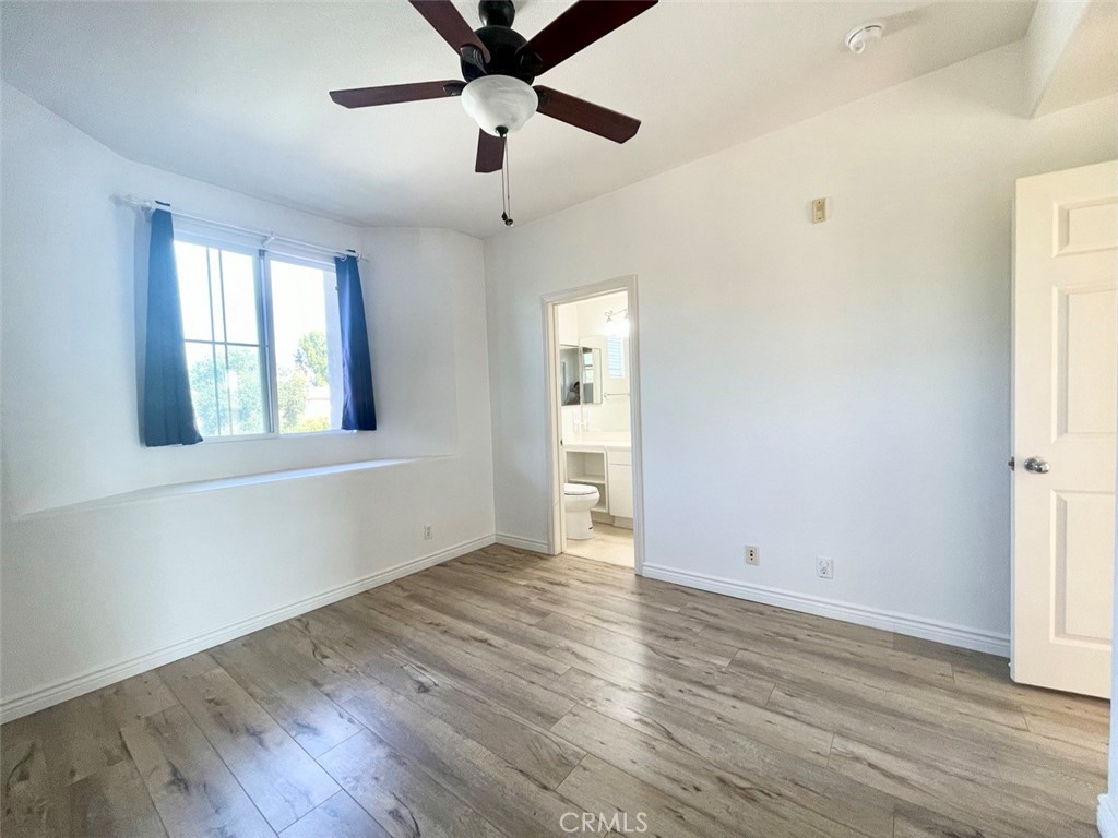 65 Passage Irvine, CA 92603 - Photo 26 of 28 an empty room with wooden floor and windows