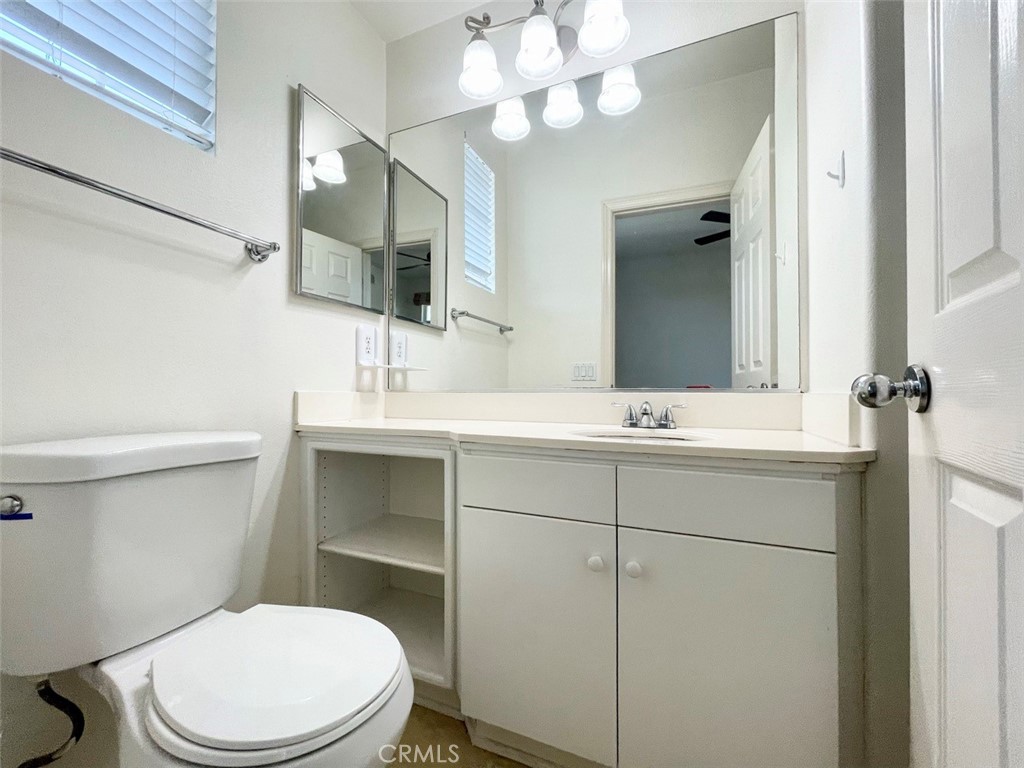 65 Passage Irvine, CA 92603 - Photo 27 of 28 a bathroom with a sink a toilet and mirror
