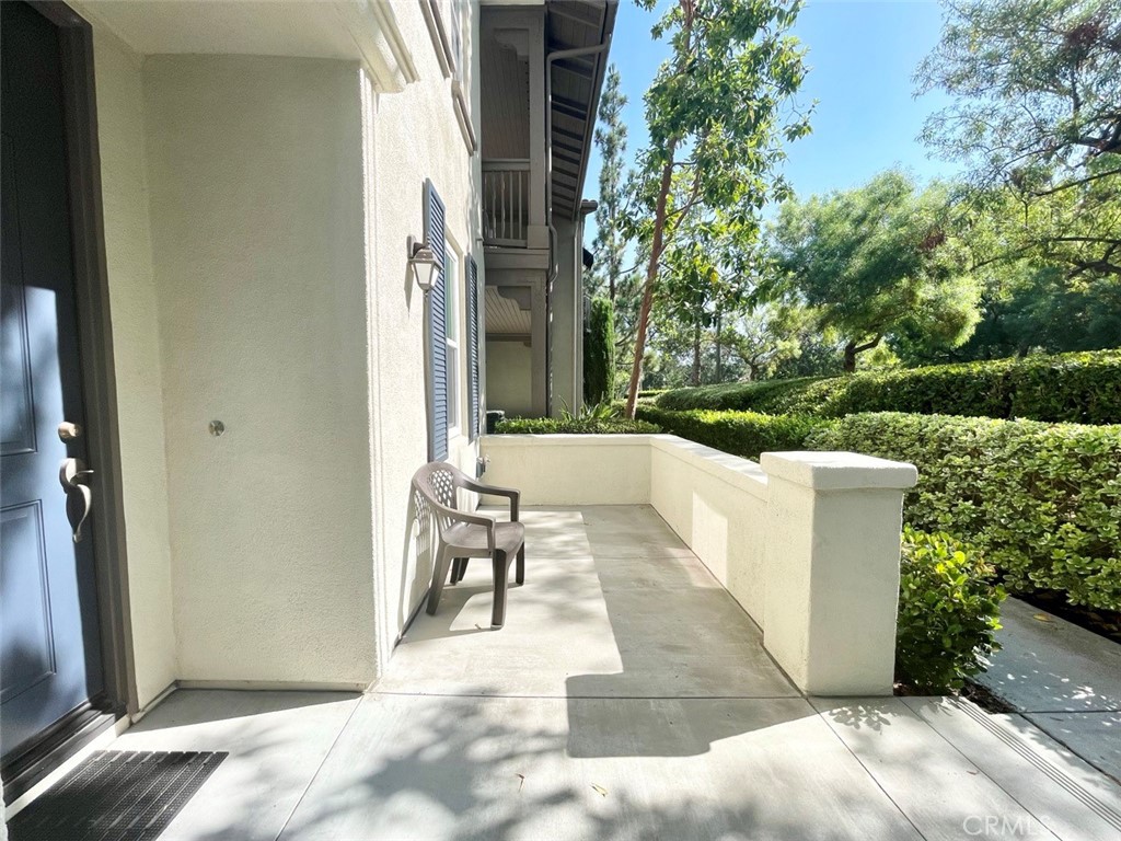 65 Passage Irvine, CA 92603 - Photo 4 of 28 a view of a patio with a table and chairs and potted plants