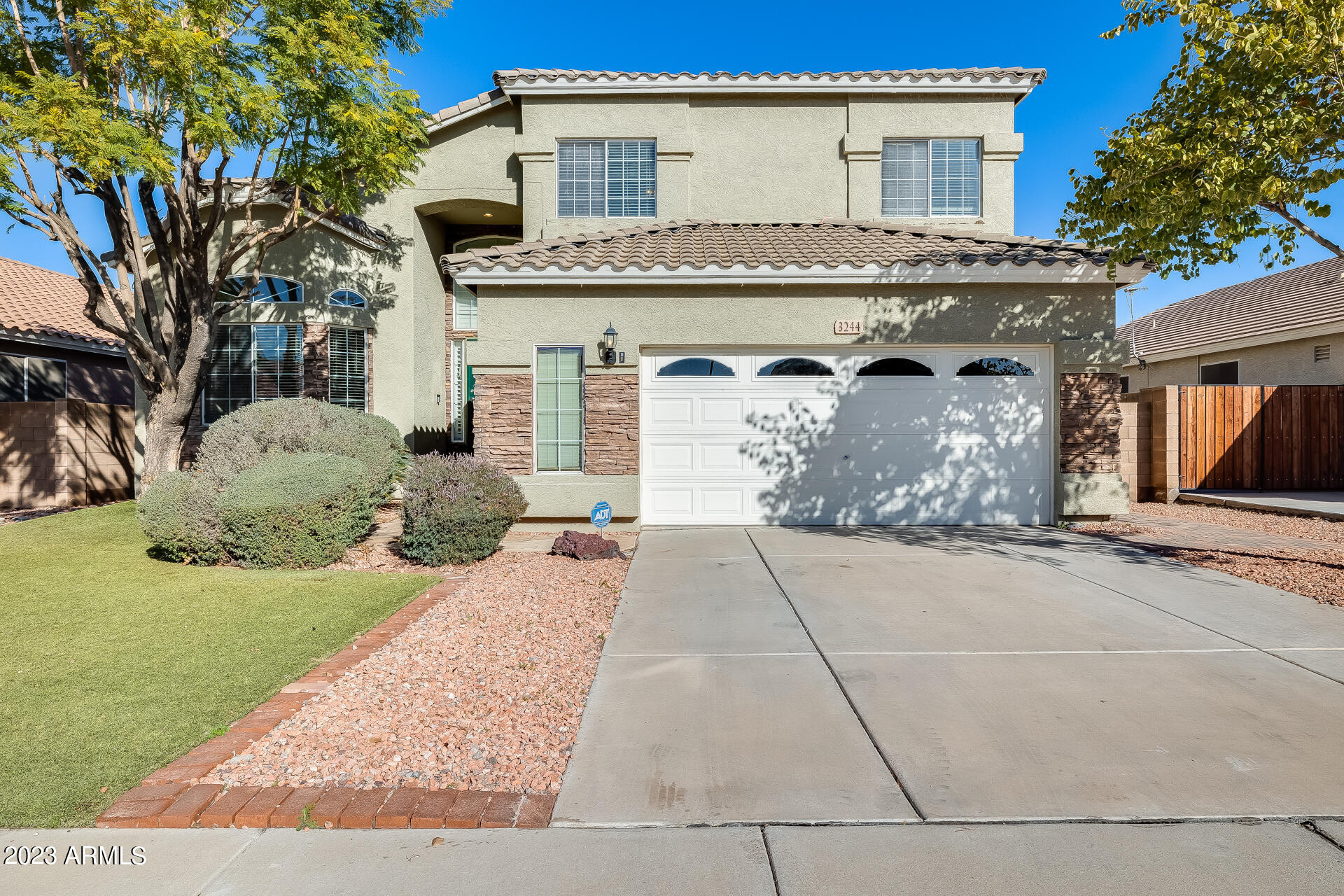 3244 West Maldonado Road Phoenix, AZ 85041 - Photo 2 of 43 a front view of a house with garden