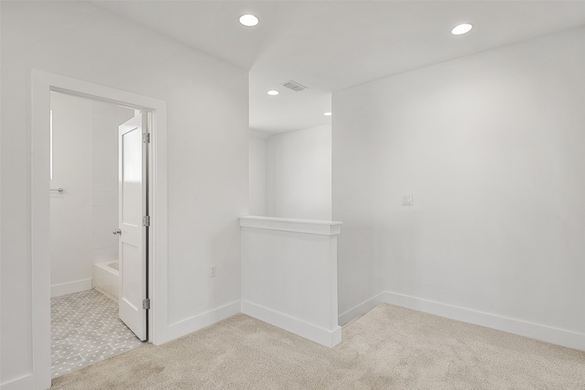 711 Paleface Ranch Road, Unit 3 Spicewood, TX 78669 - Photo 22 of 33 wooden floor in an empty room
