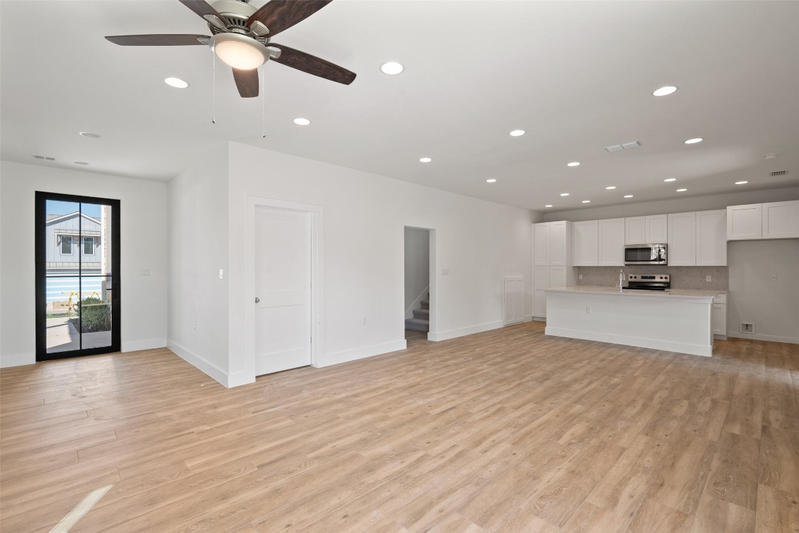 711 Paleface Ranch Road, Unit 3 Spicewood, TX 78669 - Photo 8 of 33 a view of kitchen with refrigerator and window
