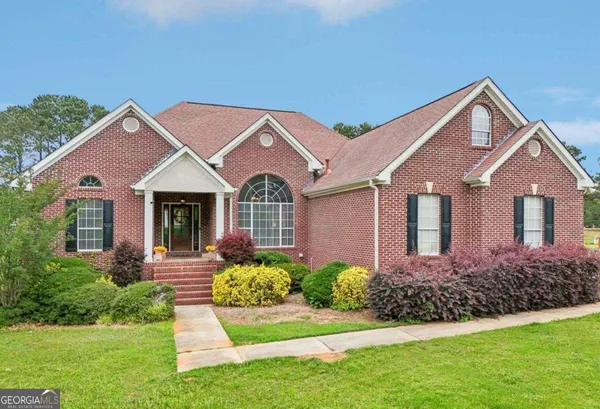 a front view of a house with a yard