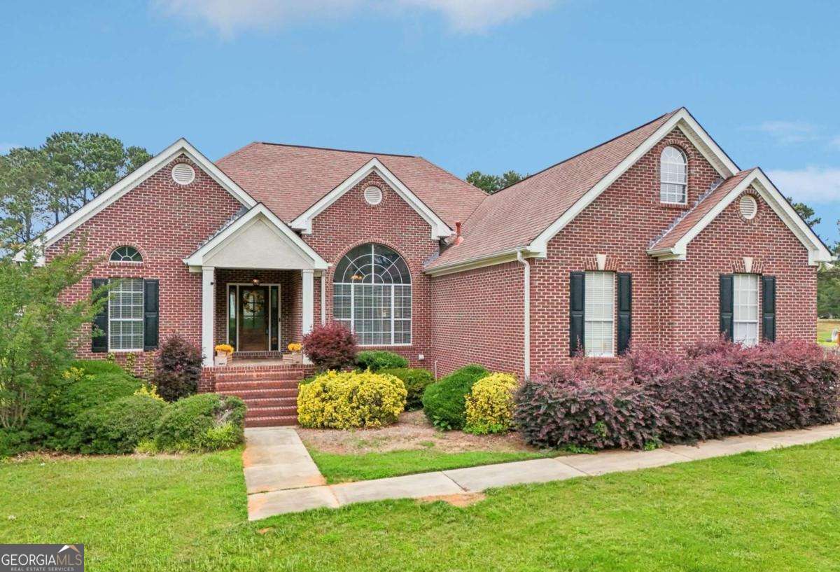 a front view of a house with a yard