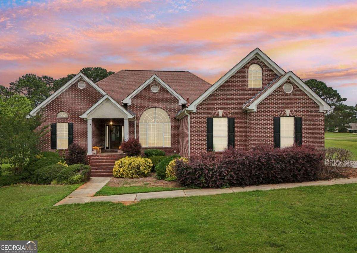 1535 Lake Dow Road McDonough, GA 30252 - Photo 2 of 9 a front view of a house with a yard