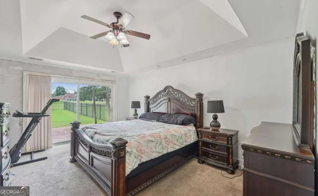 a bed room with a bed and a chandelier