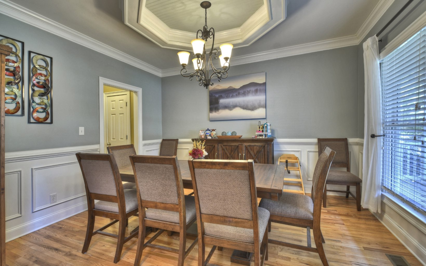 159 Meadowlark Lane Blue Ridge, GA 30513 - Photo 12 of 54 a dining room with furniture a chandelier and wooden floor