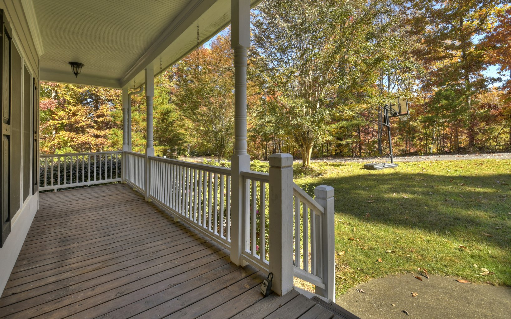 159 Meadowlark Lane Blue Ridge, GA 30513 - Photo 5 of 54 a view of a porch with wooden floor and yard