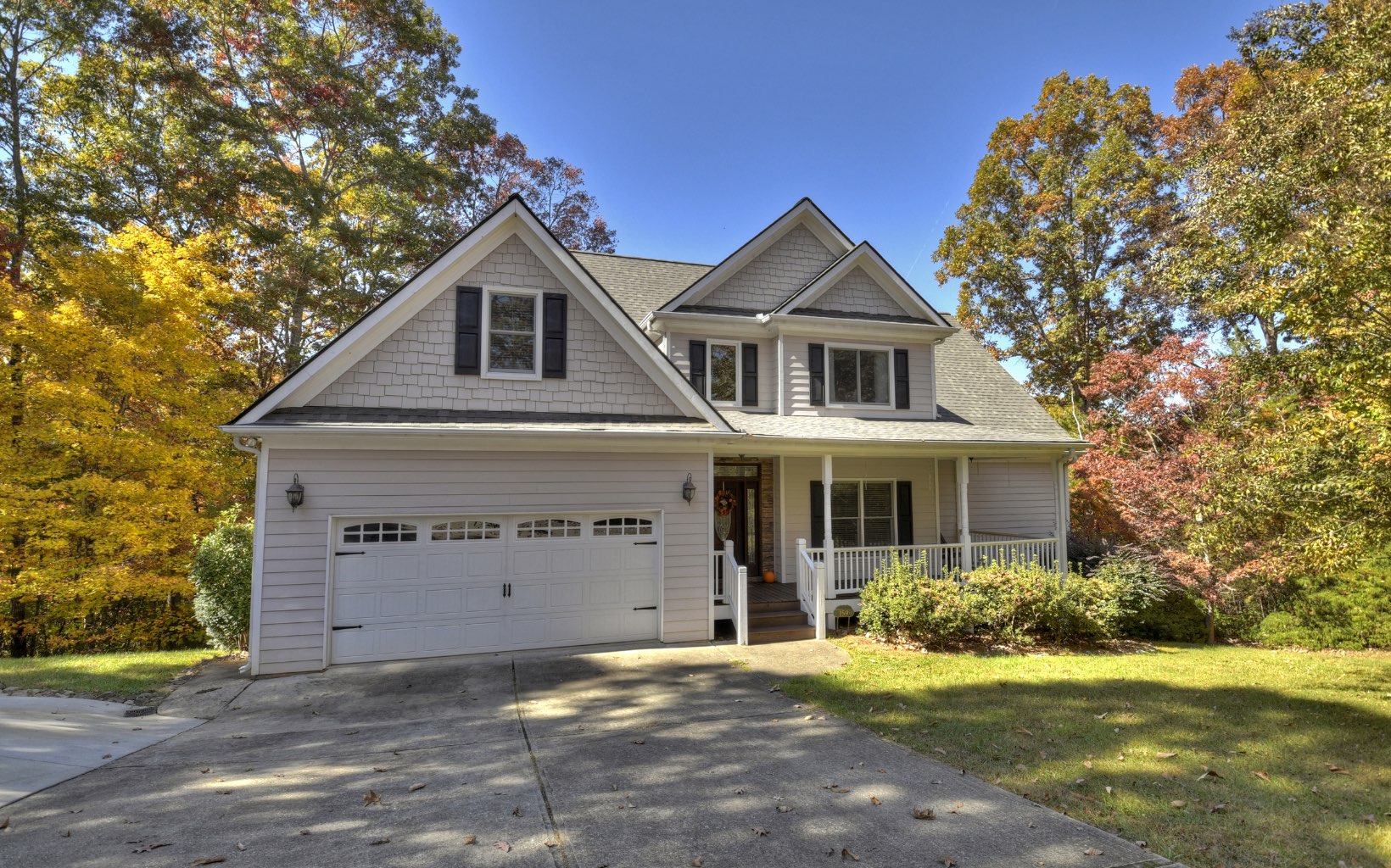 159 Meadowlark Lane Blue Ridge, GA 30513 - Photo 53 of 54 a front view of a house with a yard and garage