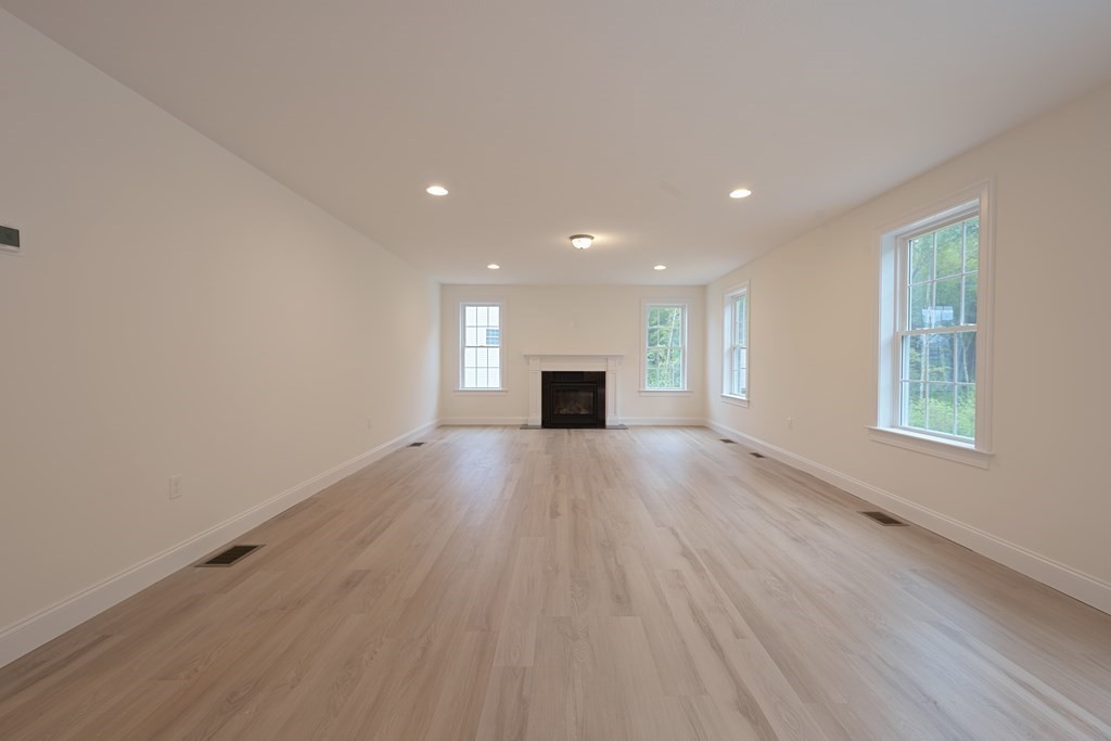 67 Hayfield Road Dracut, MA 01826 - Photo 6 of 9 wooden floor in an empty room with a window
