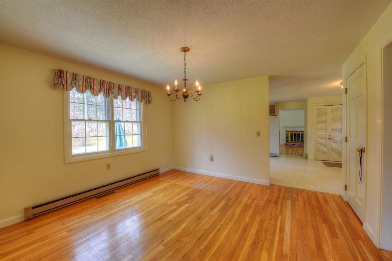1394 Old Post Road Marstons Mills, MA 02648 - Photo 9 of 35 wooden floor in an empty room with a window