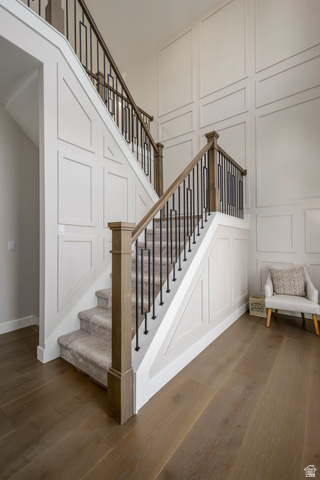 250 South Main Street, Unit 9 Alpine, UT 84004 - Photo 7 of 34 Stairway with a decorative wall, wood finished floors, and a high ceiling