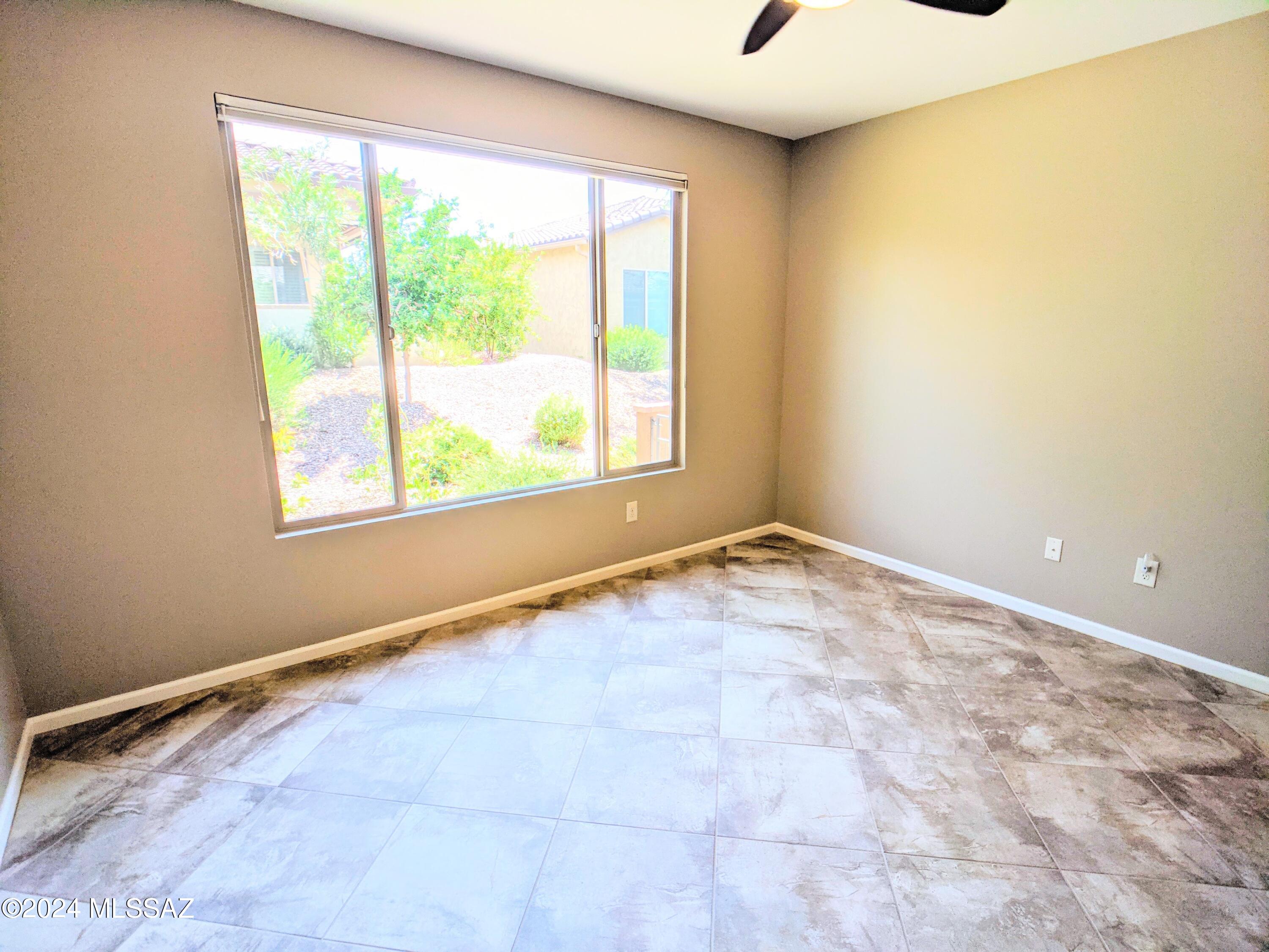 61021 East Slate Road Oracle, AZ 85623 - Photo 12 of 18 an empty room with a window
