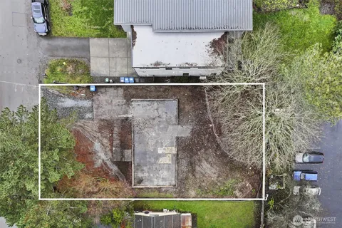 an aerial view of multiple houses with yard