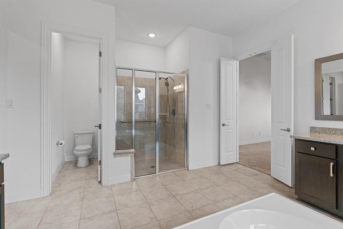 2328 Lucky Lane Leander, TX 78641 - Photo 16 of 40 a bathroom with a sink and mirror