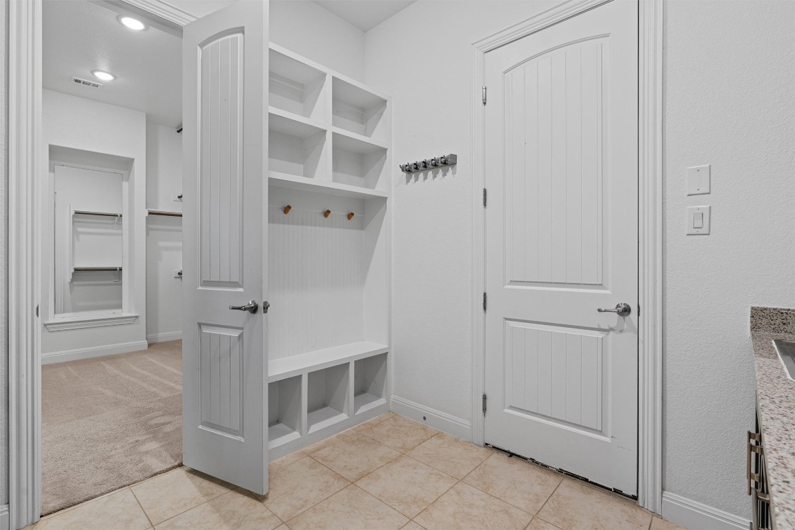 2328 Lucky Lane Leander, TX 78641 - Photo 19 of 40 view of an empty room with cabinet and entryway