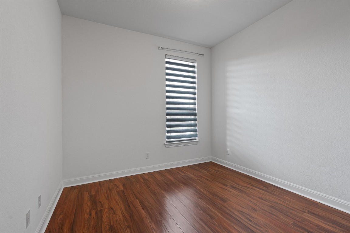 2328 Lucky Lane Leander, TX 78641 - Photo 20 of 40 a view of an empty room with wooden and window