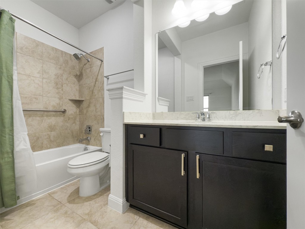 2328 Lucky Lane Leander, TX 78641 - Photo 32 of 40 a bathroom with a double vanity sink toilet and shower