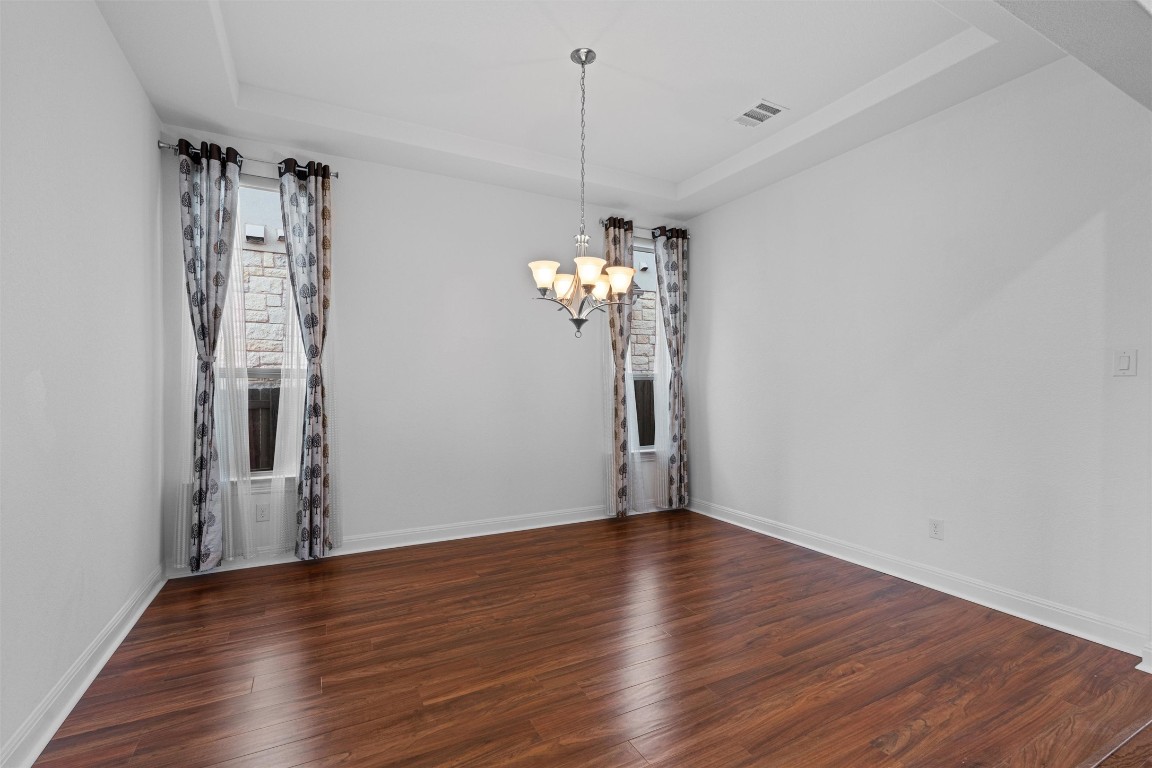 2328 Lucky Lane Leander, TX 78641 - Photo 5 of 40 a view of a room with wooden floor and ceiling fan