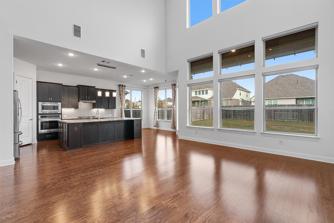 2328 Lucky Lane Leander, TX 78641 - Photo 8 of 40 a view of a kitchen and kitchen island a window