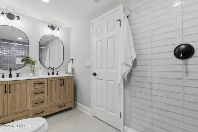 a bathroom with a sink a vanity and a mirror