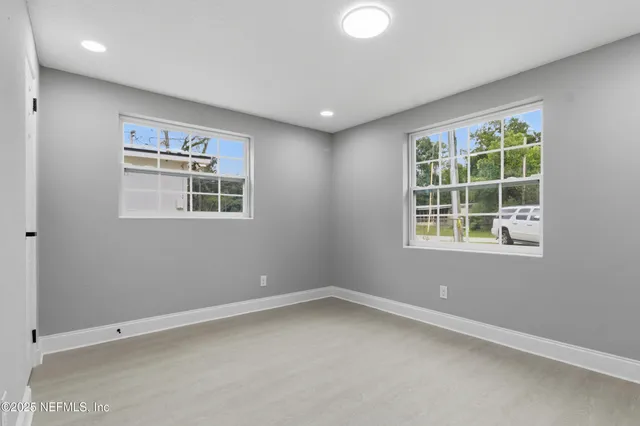 an empty room with windows