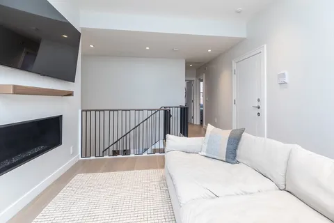 a bedroom with a bed and a fireplace