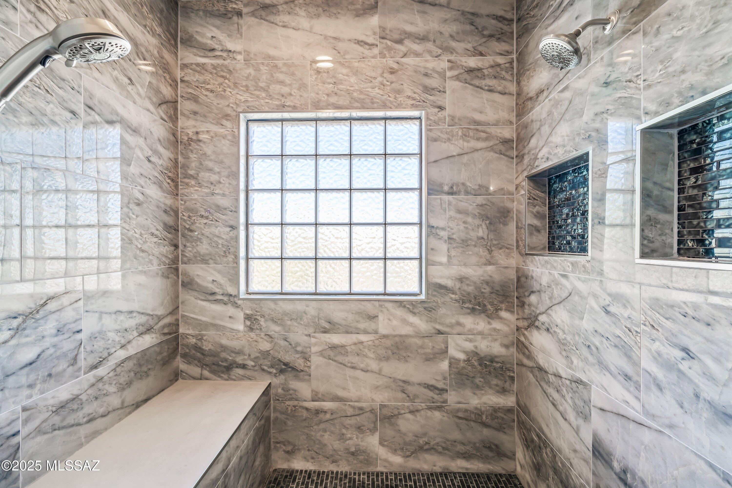 30 West Stone Loop Tucson, AZ 85704 - Photo 8 of 26 a bathroom with a bathtub and window