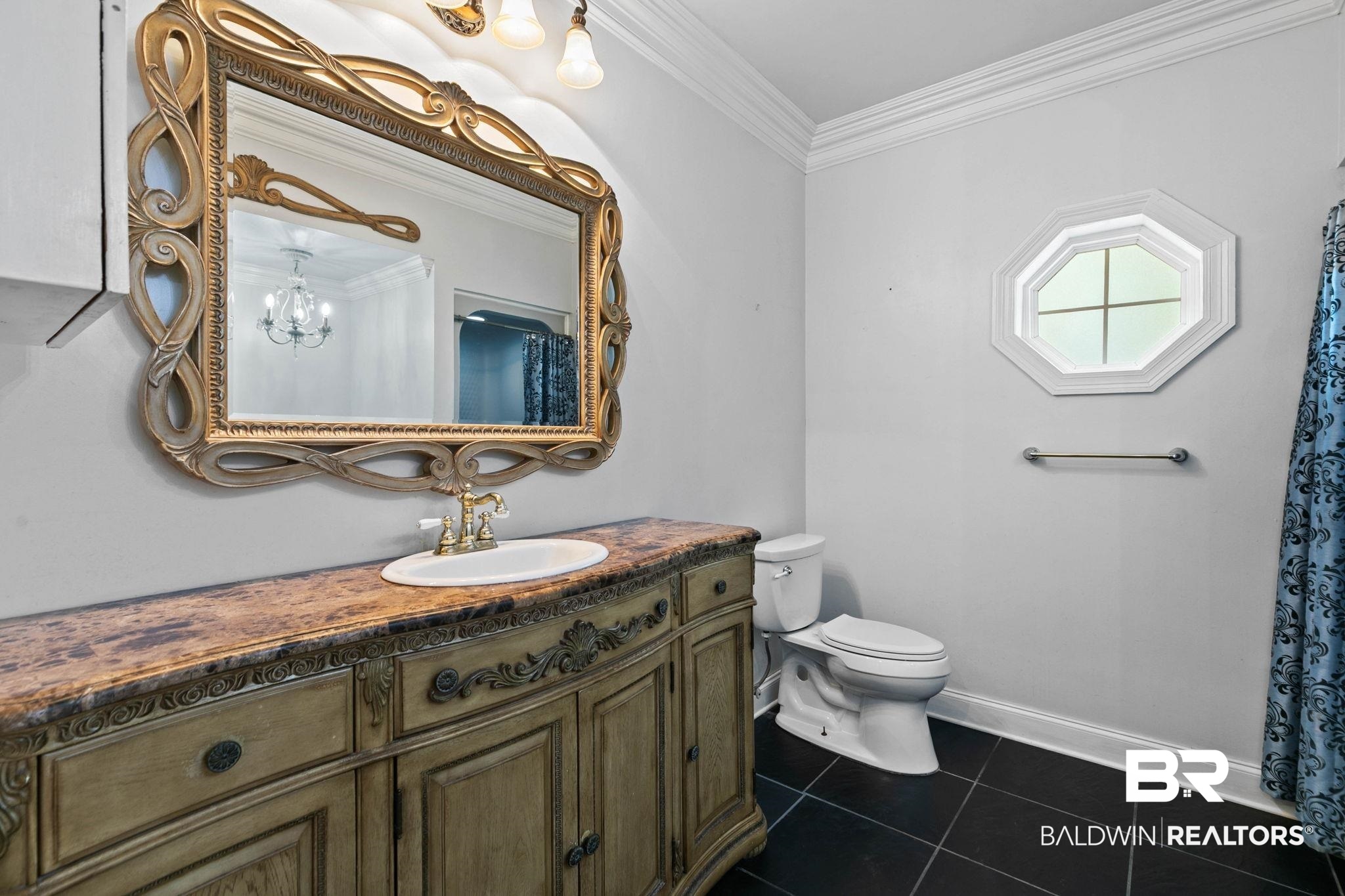 2 Speckle Trout Route Daphne, AL 36527 - Photo 20 of 61 Full bath with vanity, crown molding, dark tile patterned flooring, and curtained shower