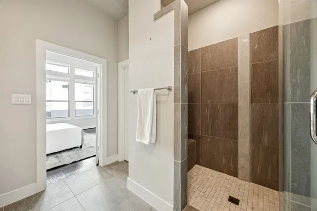 a bathroom with a tub and shower