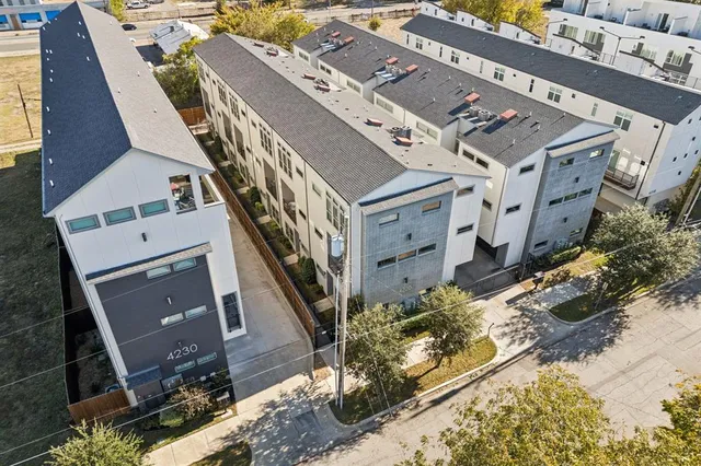 aerial view of a house with a yard