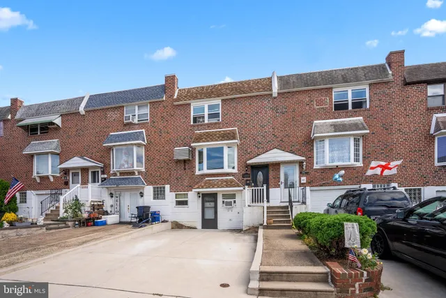 a front view of a building with garden