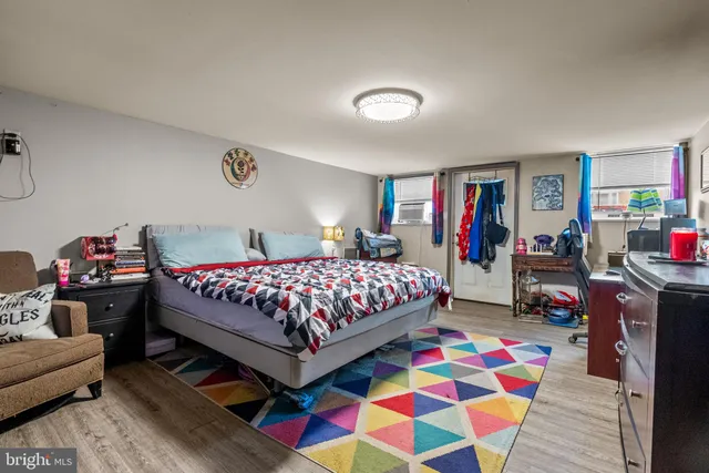 a bedroom with bed and a couch