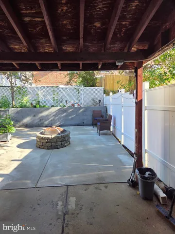 a view of a backyard of a house with a patio