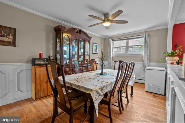 a view of a dining room with furniture and window