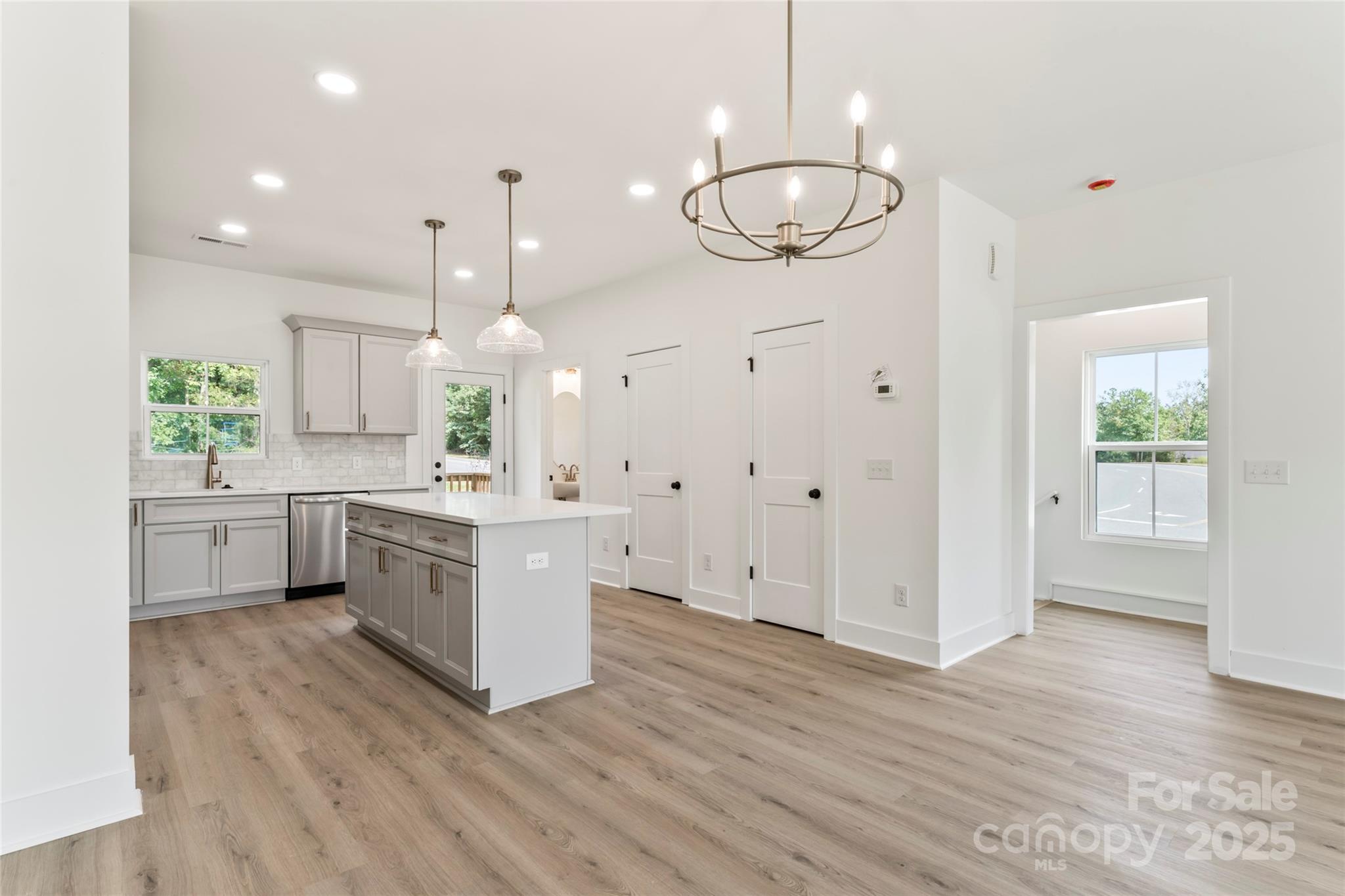 410 Bogue Drive, Unit 19 Fort Mill, SC 29708 - Photo 16 of 48 a large kitchen with a lot of cabinets and wooden floor