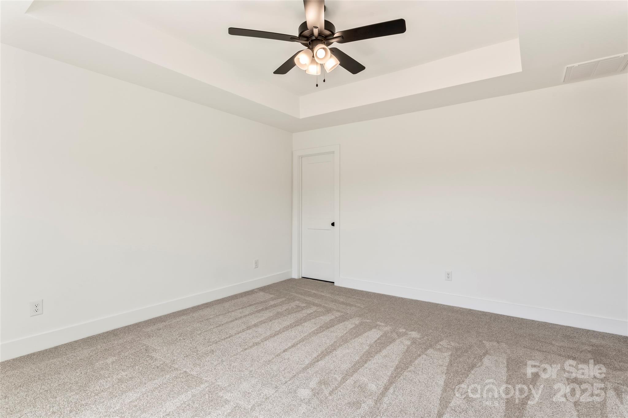 410 Bogue Drive, Unit 19 Fort Mill, SC 29708 - Photo 24 of 48 an empty room with a ceiling fan and wooden floor