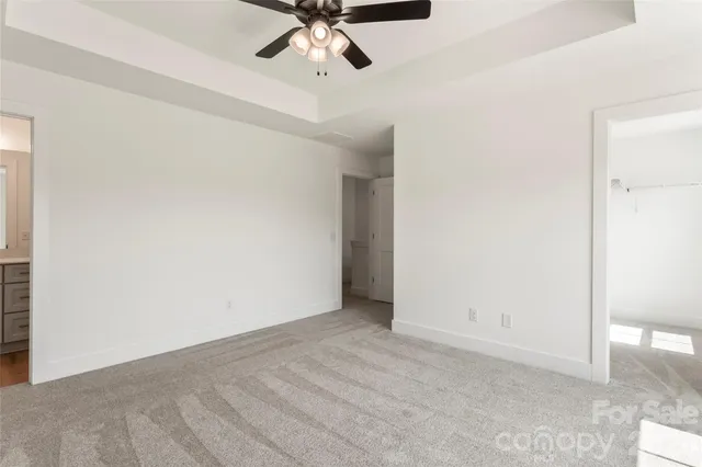 a bathroom with a sink a toilet and a large mirror