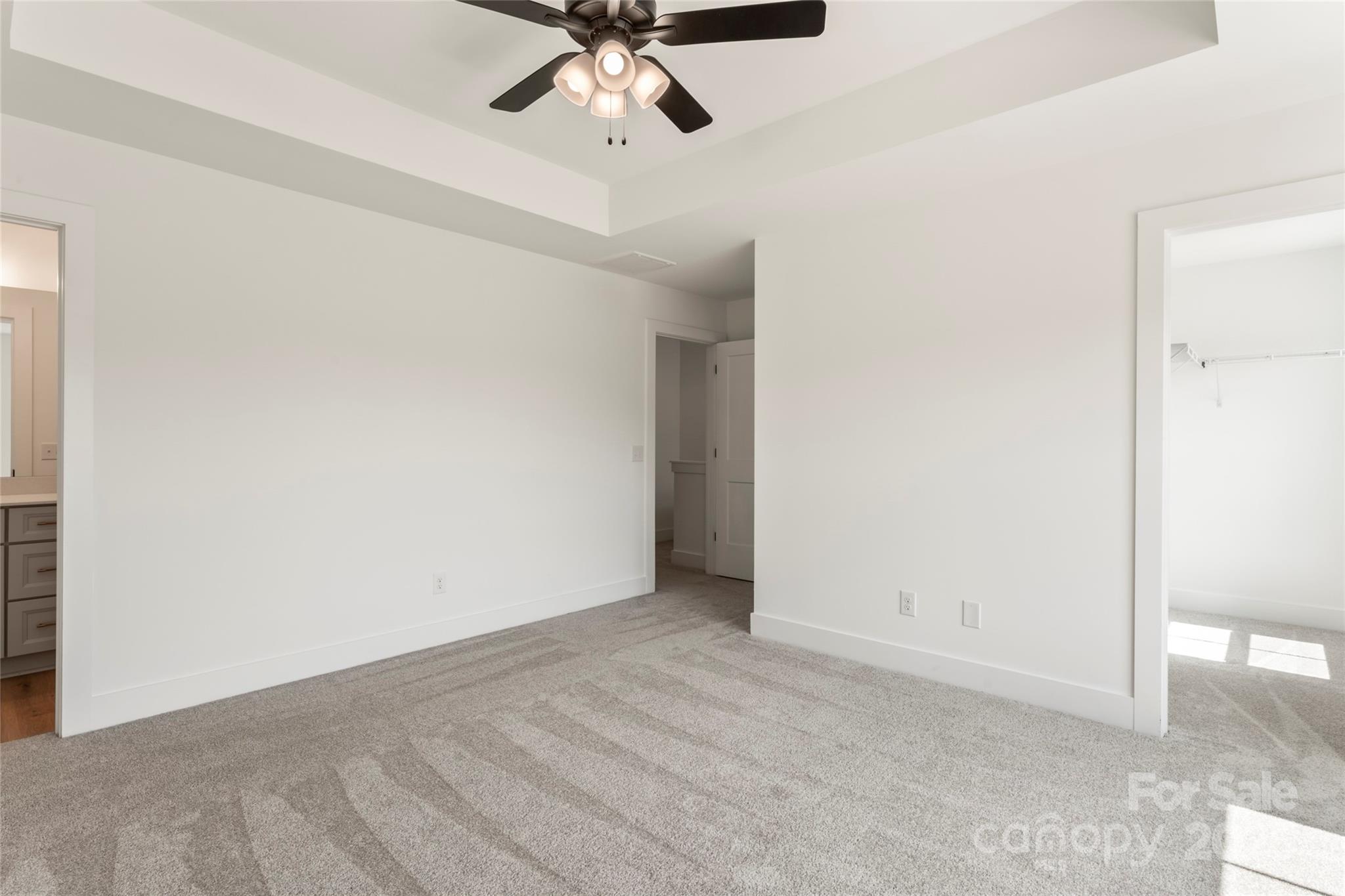 410 Bogue Drive, Unit 19 Fort Mill, SC 29708 - Photo 26 of 48 an empty room with a ceiling fan and carpet