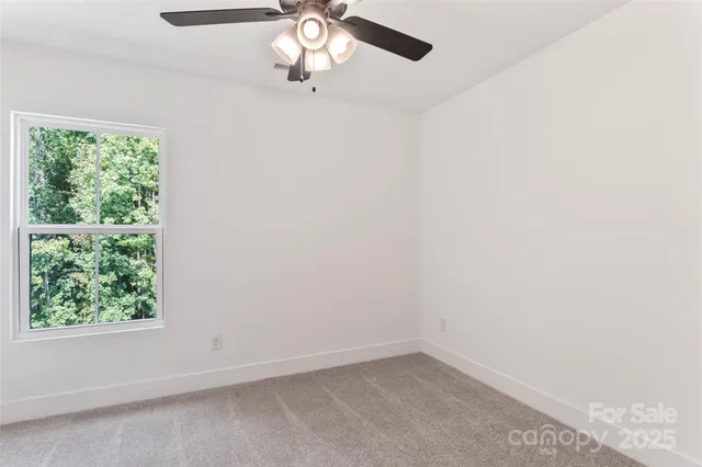 an empty room with a view of a bathroom