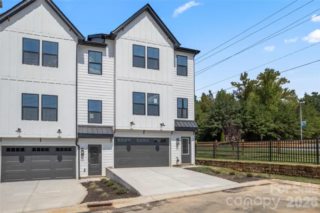 a front view of a house with a garage