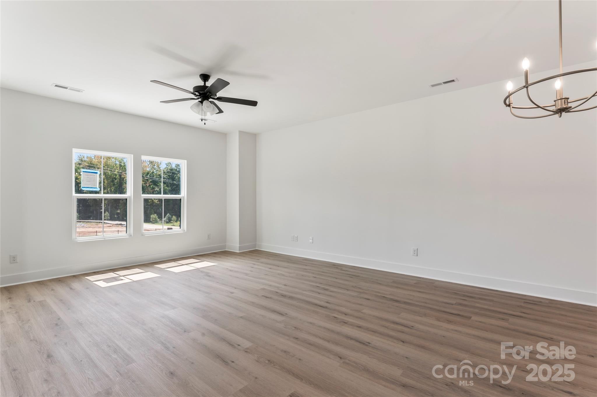 410 Bogue Drive, Unit 19 Fort Mill, SC 29708 - Photo 9 of 48 a view of empty room with wooden floor and fan
