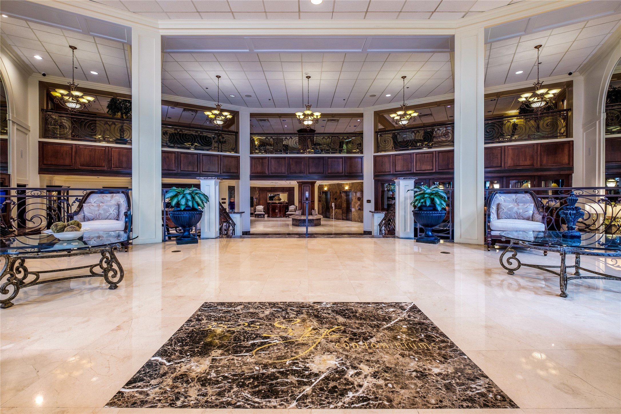 3525 Sage Road, Unit 1210 Houston, TX 77056 - Photo 18 of 20 Elegant lobby with grand marble flooring, ornate iron railings, and cozy seating areas, offering a luxurious first impression.