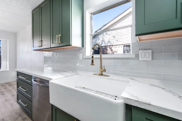 a kitchen with a sink and a window