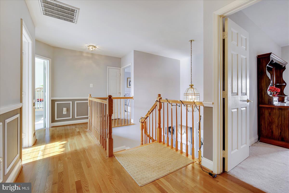 18267 Wickham Road Olney, MD 20832 - Photo 44 of 107 Hardwood hallway leads to 5 BR, 3 Bathrooms