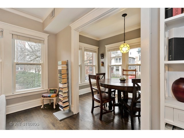 725 West Buckingham Place, Unit 1 Chicago, IL 60657 - Photo 9 of 12 a view of a dining room with furniture window and outside view