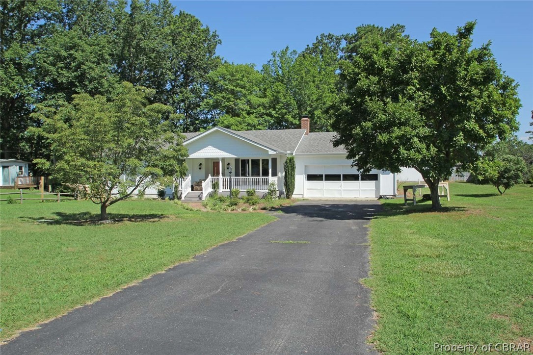 1621 Locust Grove Road Topping, VA 23169 - Photo 1 of 48 View of the Front of Home with a Nice Paved Driveway & Attached Garage