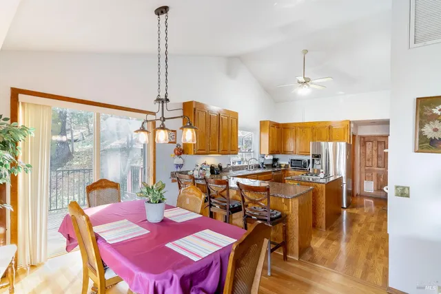 a view of a dining room with furniture window and outside view