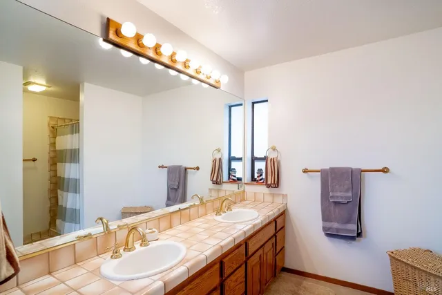 a dining room with a table and chairs